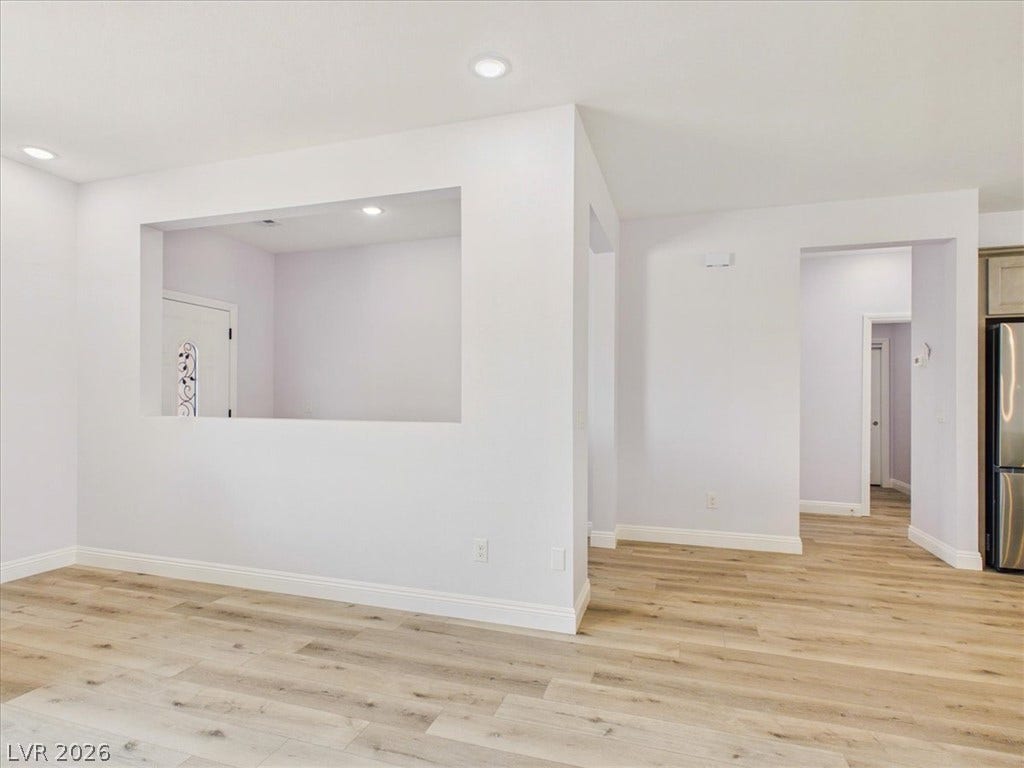 6680 S Raintree Court, Pahrump, NV 89061 Clean lines and wide plank flooring define this airy, open-concept living space.