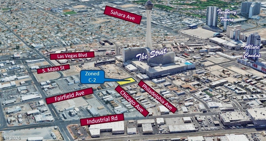 An aerial perspective highlights a prime commercial lot situated near the iconic Las Vegas Strip.