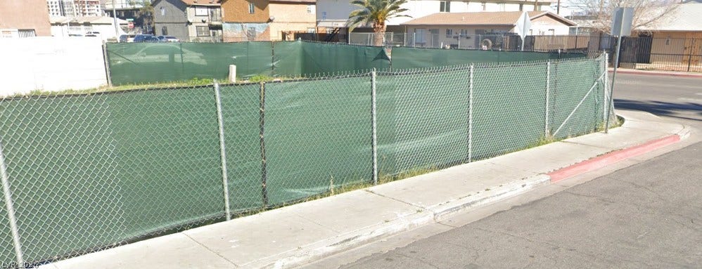 200 W Chicago Avenue, Las Vegas, NV 89102 Chain link fencing borders this corner lot positioned along neighborhood sidewalks.