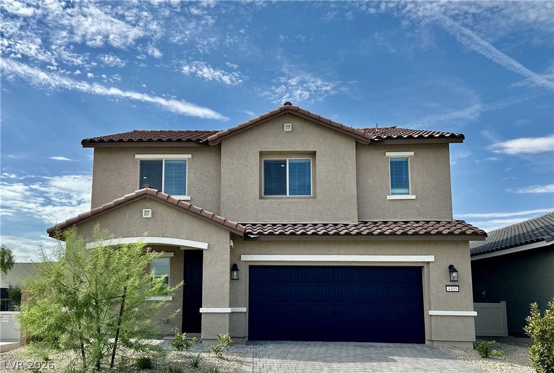 3257 Basin Desert Street, North Las Vegas, NV 89032 Tile rooflines and stucco finishes define this contemporary two-story exterior facade.