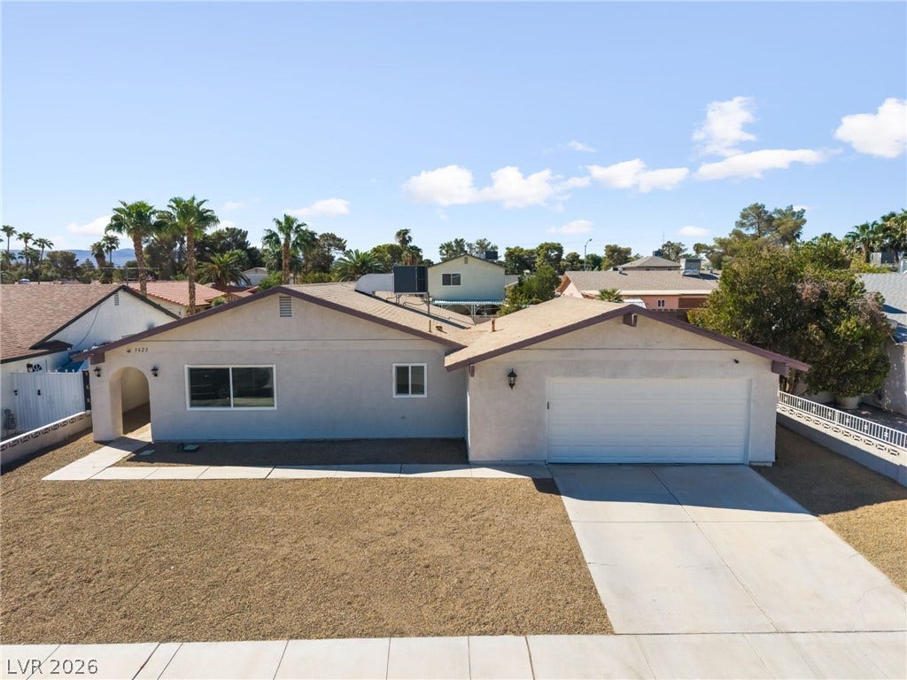 3623 E Biela Avenue, Las Vegas, NV 89120 A spacious driveway and neat desert landscaping frame this classic single-story home.