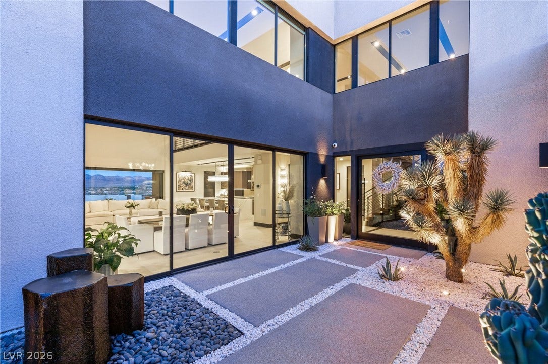 Modern desert oasis featuring striking architecture, sleek patio, and captivating landscape elements.