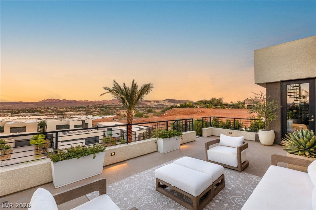 Perched high above, this rooftop terrace offers sweeping views of the distant mountains and city lights.