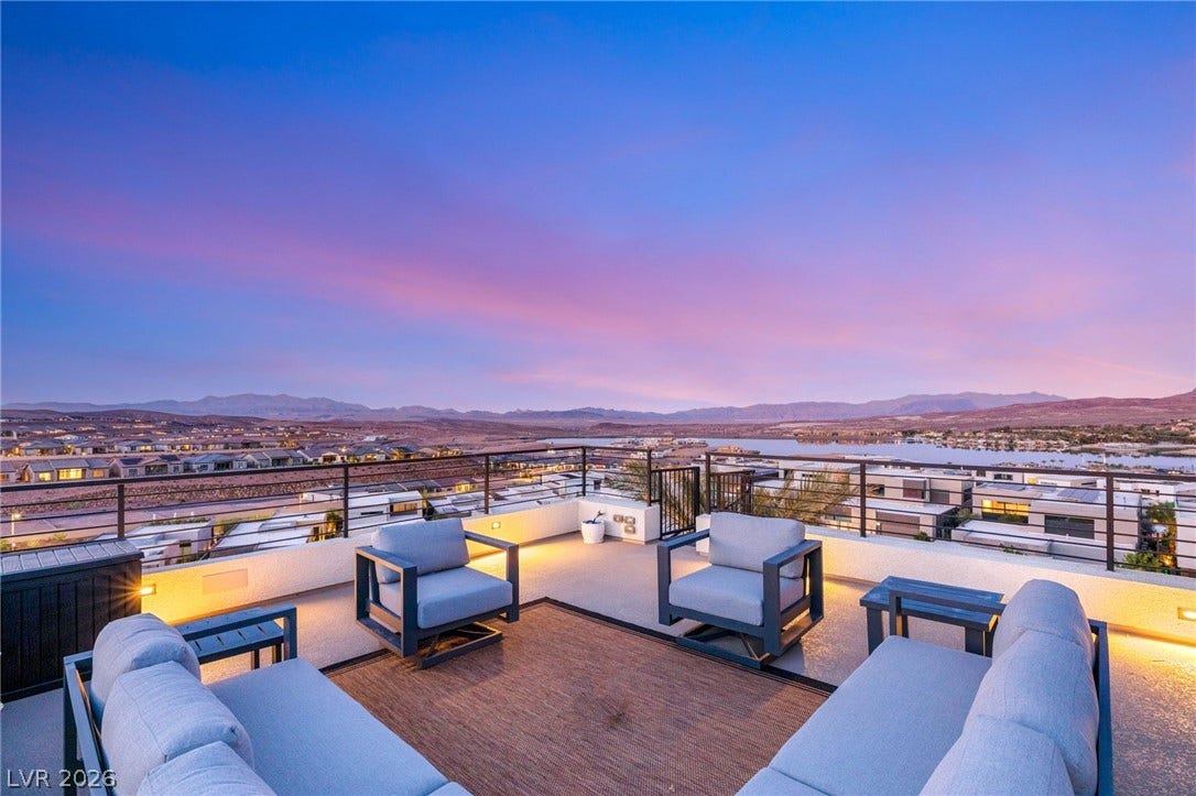 A spacious rooftop terrace offers unparalleled lake and mountain vistas.