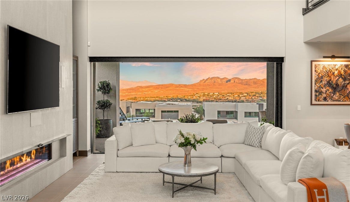 Dramatic mountain vistas frame this living space, offering tranquil desert views.