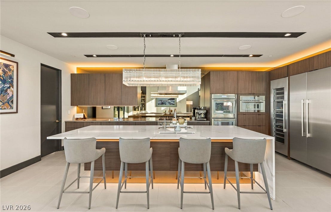 Culinary excellence awaits in this kitchen, featuring stainless steel appliances and an oversized island for effortless entertaining.