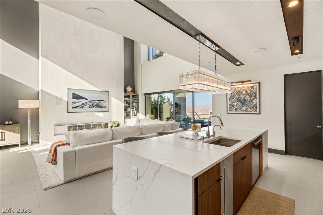 An open-concept living space with a gourmet kitchen island and soaring ceilings, perfect for entertaining.