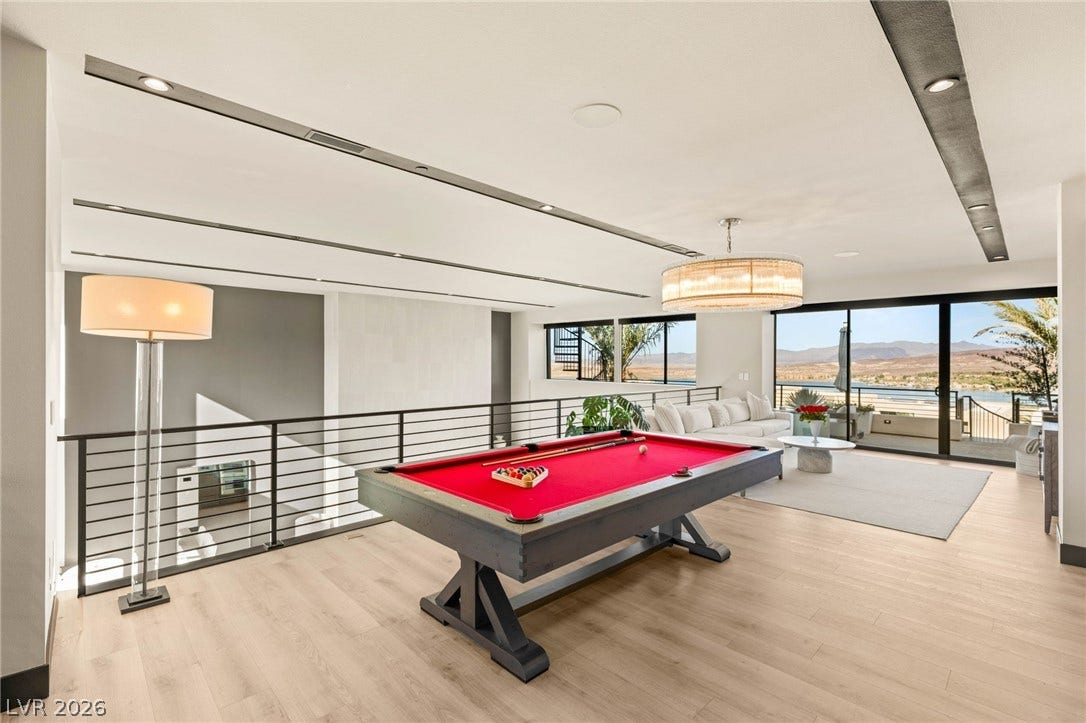A spacious game room with expansive views, offering a perfect blend of entertainment and relaxation.