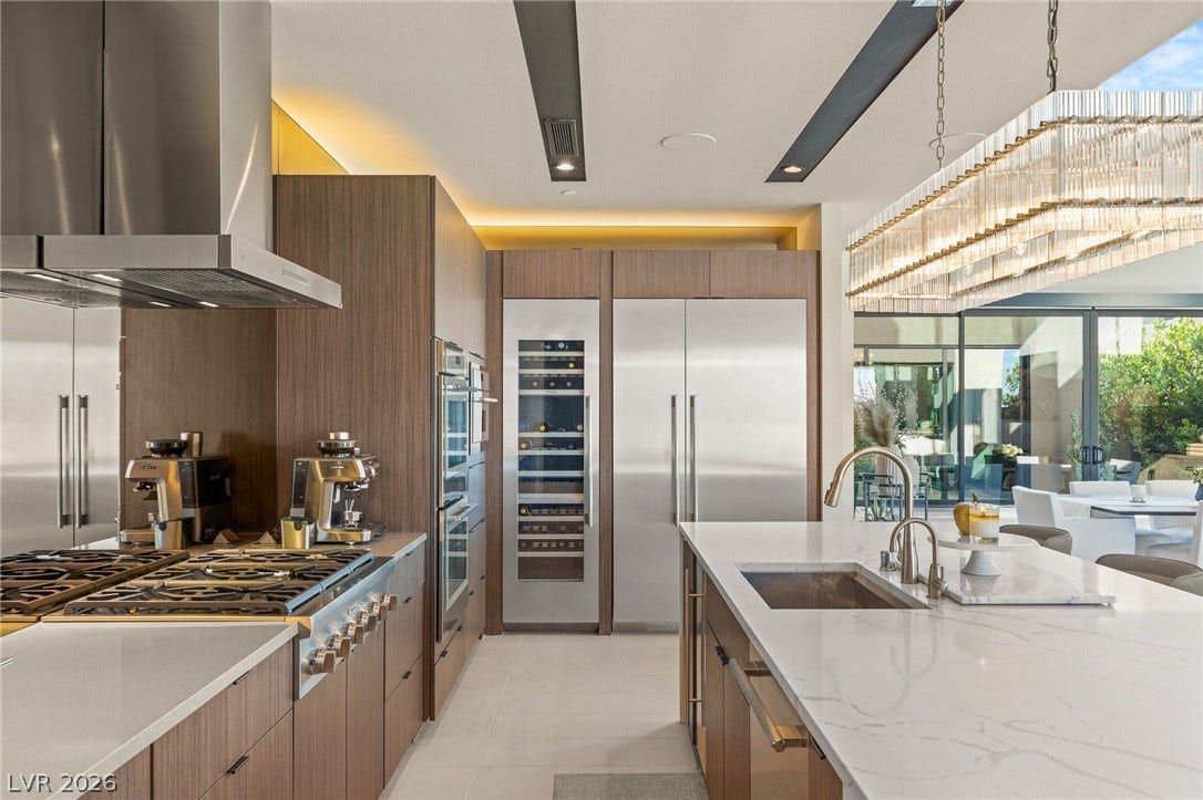 Culinary excellence awaits in this well-appointed kitchen, featuring a spacious island and gleaming appliances.