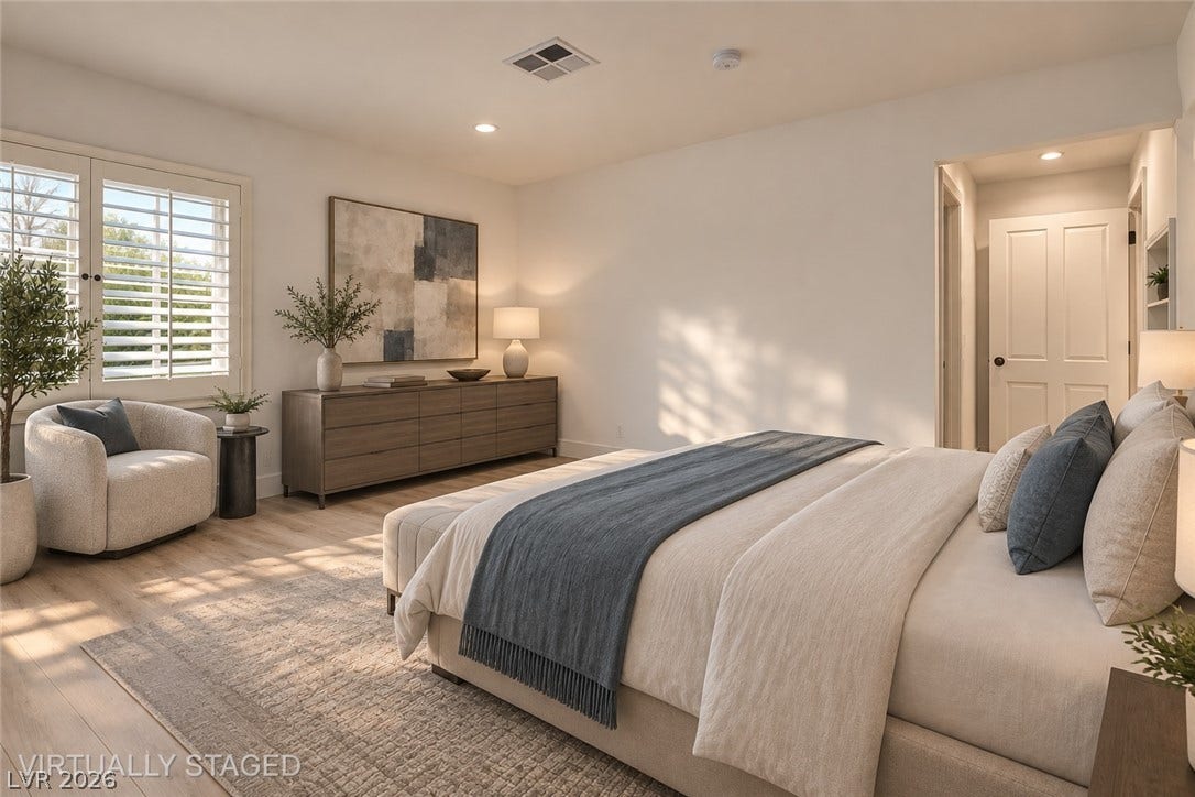 2001 Silver Avenue, Las Vegas, NV 89102 An inviting bedroom features smooth wood flooring and custom plantation shutters filtering the natural light.
