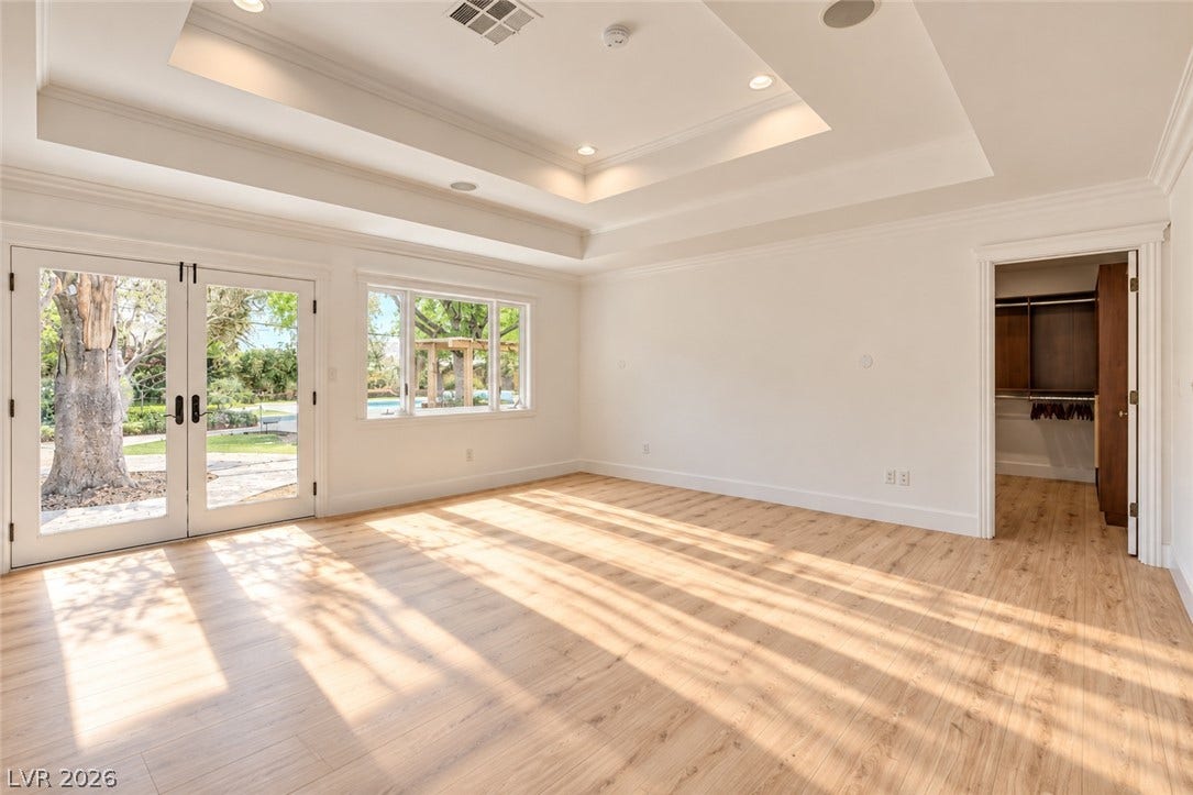 2001 Silver Avenue, Las Vegas, NV 89102 Gleaming hardwood floors and an elegant tray ceiling define this airy bedroom space.