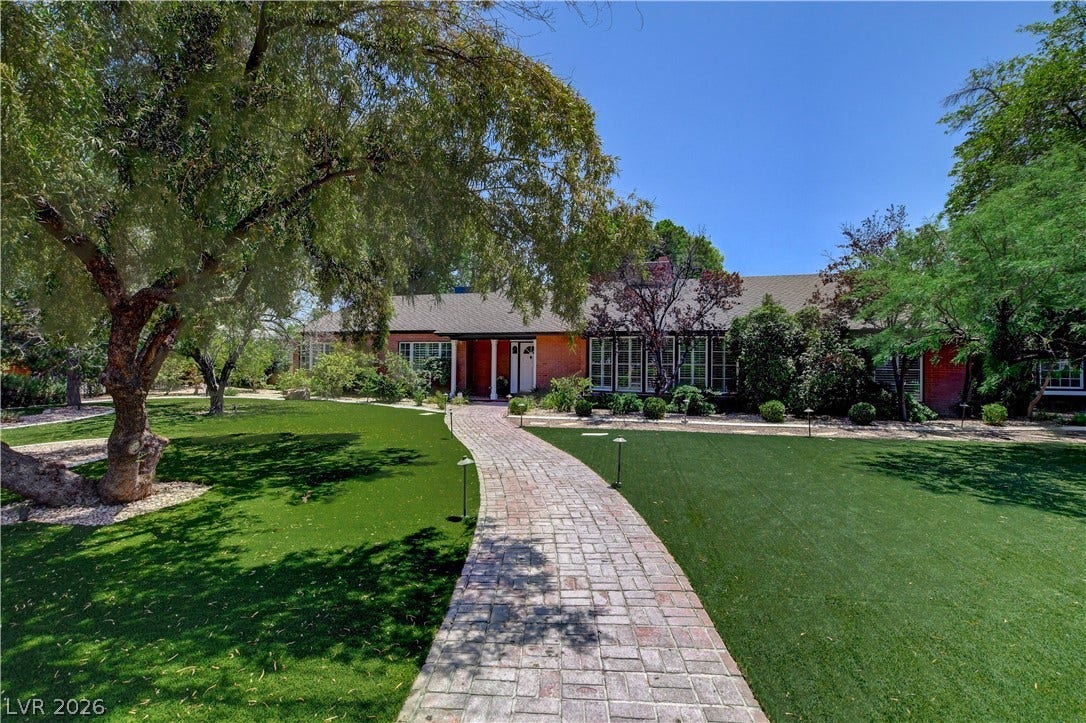 2001 Silver Avenue, Las Vegas, NV 89102 A sweeping brick pathway leads through manicured lawns to this classic brick-accented residence.