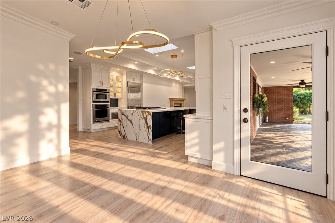 2001 Silver Avenue, Las Vegas, NV 89102 Sunlight streams across rich hardwood floors in this open-concept layout leading directly to the kitchen.