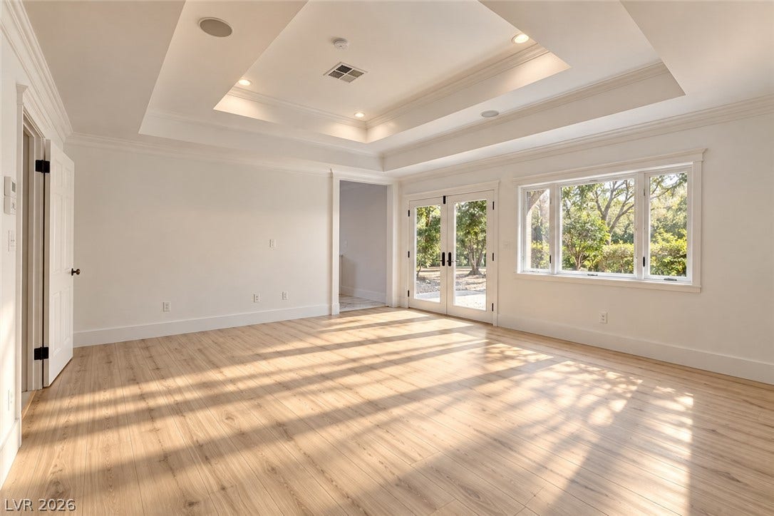 2001 Silver Avenue, Las Vegas, NV 89102 Warm wood flooring, recessed lighting, and a tray ceiling define this versatile interior space.