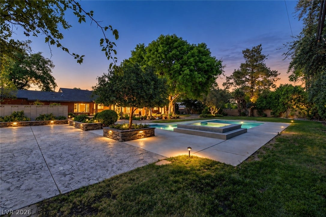 2001 Silver Avenue, Las Vegas, NV 89102 Lush landscaping and stone pathways encircle a pristine swimming pool and integrated spa.
