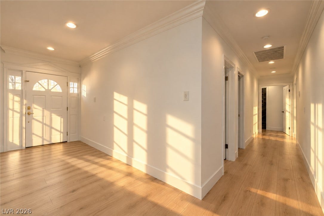 2001 Silver Avenue, Las Vegas, NV 89102 Warm sunlight streams across the smooth wood floors of this welcoming entry foyer and hallway.