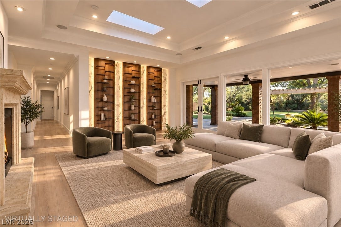 2001 Silver Avenue, Las Vegas, NV 89102 Custom built-in shelving and high ceilings with skylights define this open living space.
