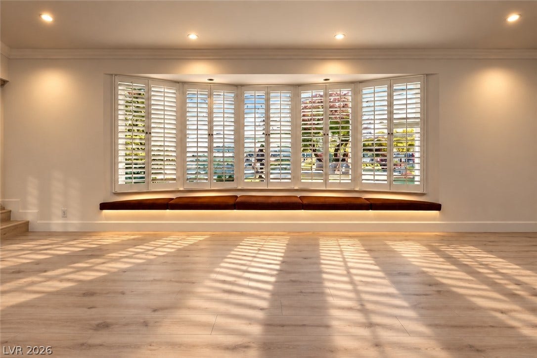 2001 Silver Avenue, Las Vegas, NV 89102 Sunlight filters through classic shutters onto the warm wood floors of this inviting room.