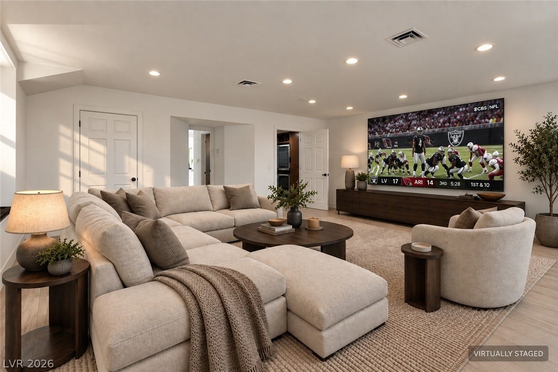 2001 Silver Avenue, Las Vegas, NV 89102 Recessed lighting illuminates this comfortable living area featuring light wood flooring and clean lines.