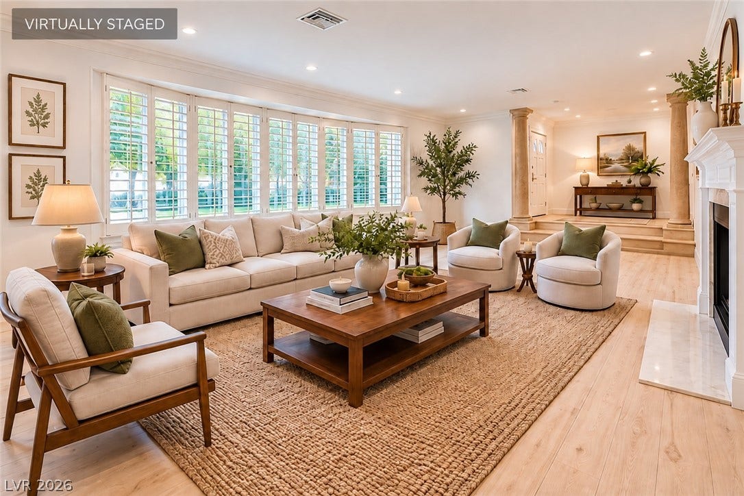 2001 Silver Avenue, Las Vegas, NV 89102 Sunlight streams through expansive plantation shutters onto warm hardwood floors in this elegant living room.