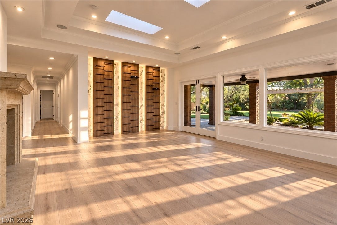 2001 Silver Avenue, Las Vegas, NV 89102 Hardwood floors and built-in wall shelving define this spacious interior under recessed lighting.