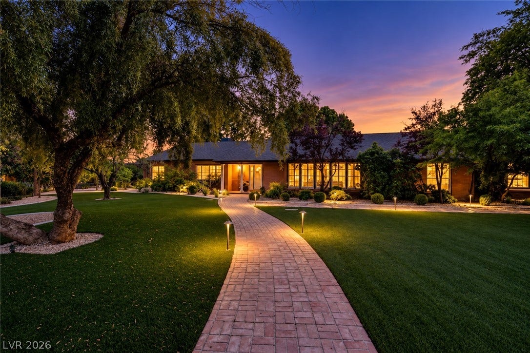 2001 Silver Avenue, Las Vegas, NV 89102 A winding brick pathway leads to the glowing entrance of this sprawling single-story residence.