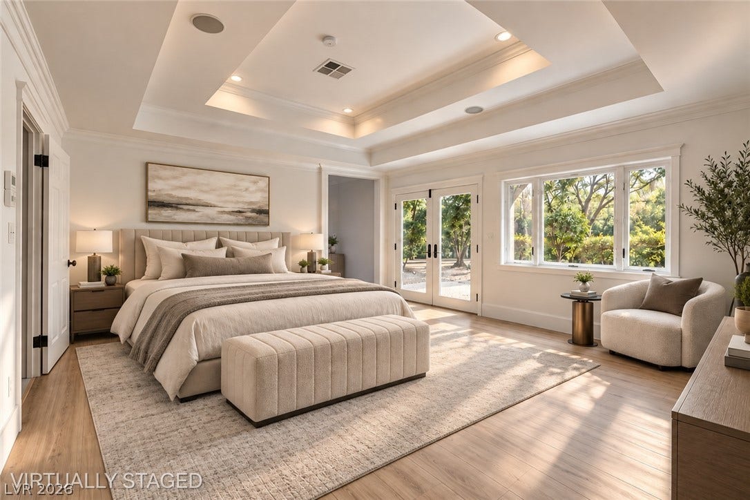 2001 Silver Avenue, Las Vegas, NV 89102 A tray ceiling highlights this spacious bedroom complete with hardwood flooring and double doors.