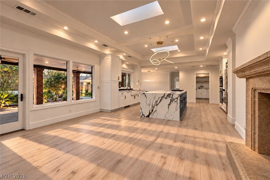 2001 Silver Avenue, Las Vegas, NV 89102 Sunlight streams across the wide-plank wood flooring in this grand, open-concept living space.