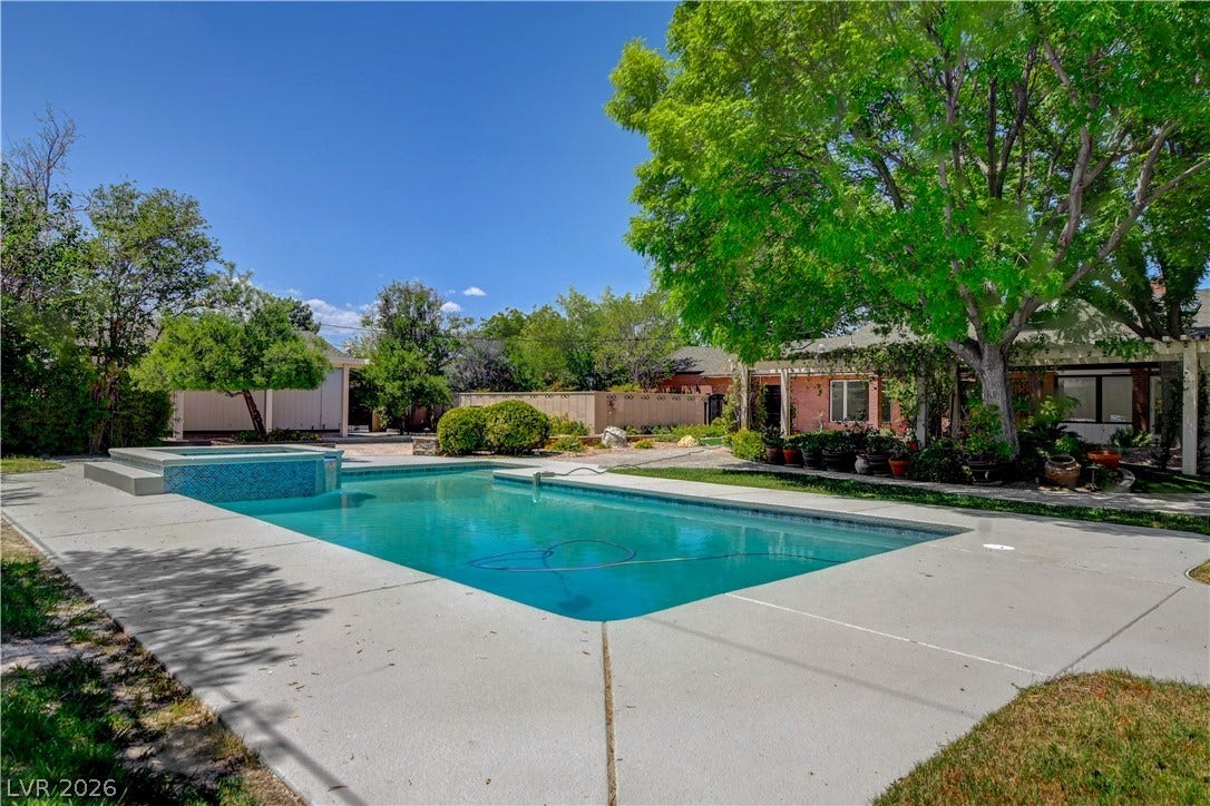 2001 Silver Avenue, Las Vegas, NV 89102 A sparkling swimming pool highlights this backyard oasis surrounded by mature trees.