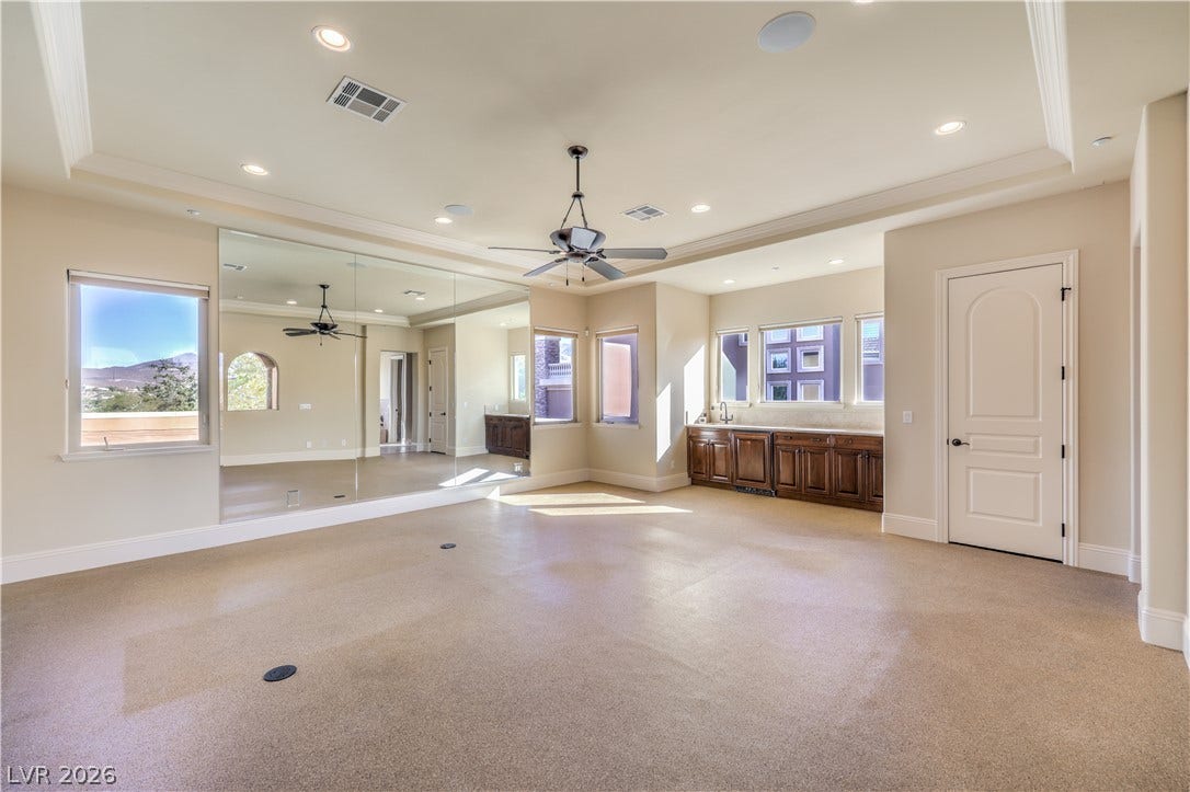 16 Anthem Pointe Court, Henderson, NV 89052 Recessed lighting, elegant crown molding, and integrated wet bar cabinetry highlight this versatile bonus room.