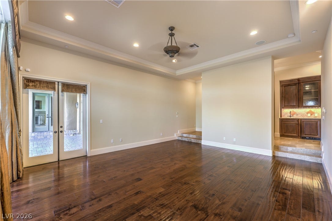 16 Anthem Pointe Court, Henderson, NV 89052 Rich hardwood floors and a tray ceiling with recessed lighting define this spacious interior.