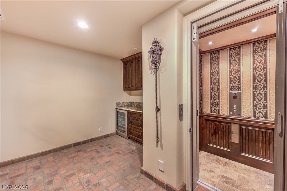 16 Anthem Pointe Court, Henderson, NV 89052 Multi-level accessibility is made effortless with a private in-home elevator adjacent to the wet bar.