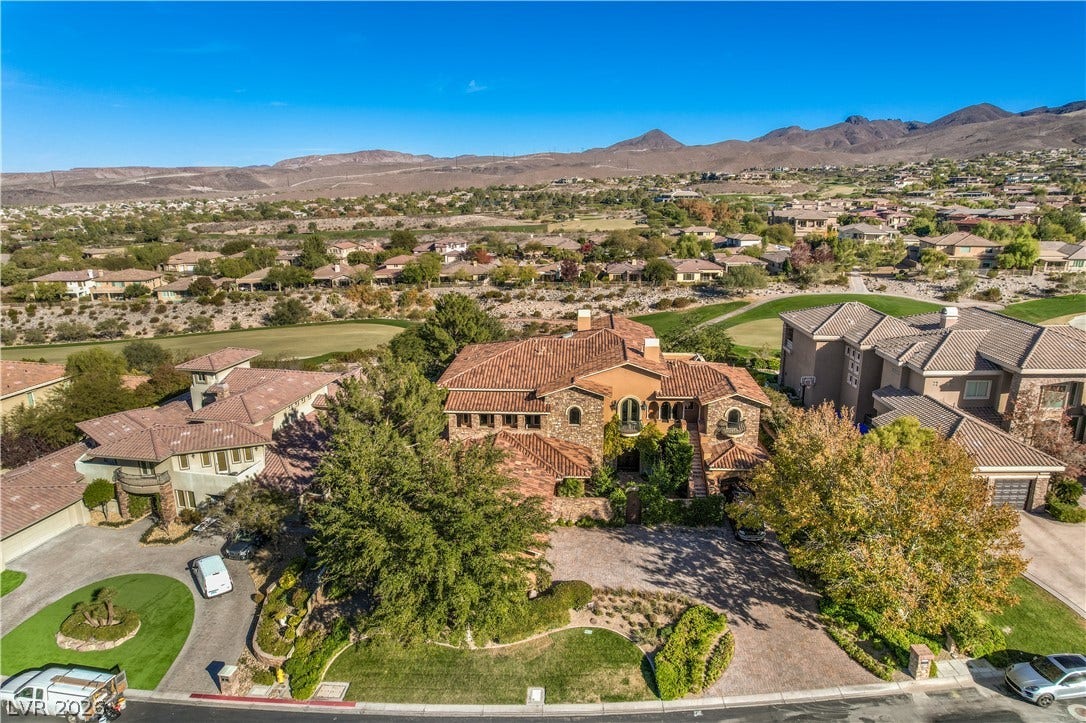 16 Anthem Pointe Court, Henderson, NV 89052 Striking Spanish-style rooflines frame this desert estate overlooking a lush golf course greenspace.
