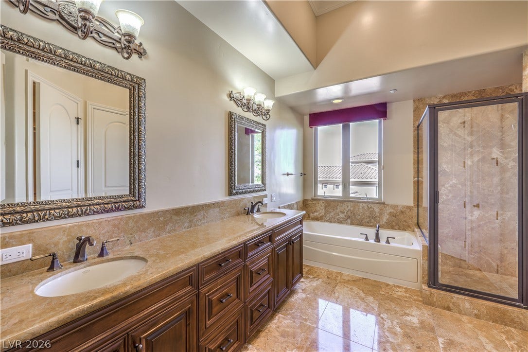 16 Anthem Pointe Court, Henderson, NV 89052 Stone counters and custom tile flooring elevate this elegant master bath retreat.