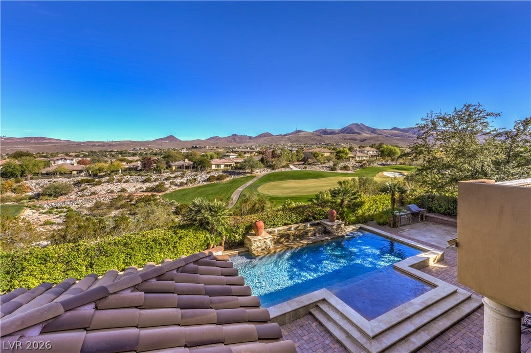 16 Anthem Pointe Court, Henderson, NV 89052 Panoramic mountain and golf course views frame this glistening backyard swimming pool.