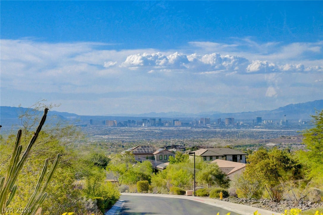 84 Kittansett Loop, Henderson, NV 89052 Far-reaching desert views stretch across the valley toward a distant metropolitan skyline.