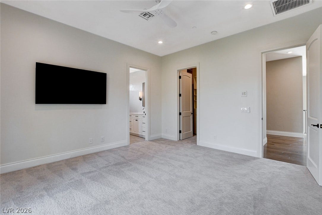 84 Kittansett Loop, Henderson, NV 89052 Smooth plaster walls and soft carpeting define this serene, comfortable sleeping space.