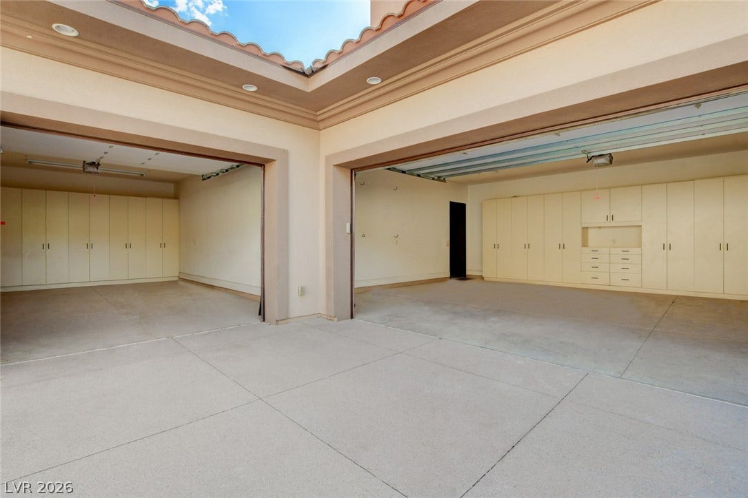 84 Kittansett Loop, Henderson, NV 89052 Massive garage bays offer extensive built-in storage cabinetry along concrete floors.