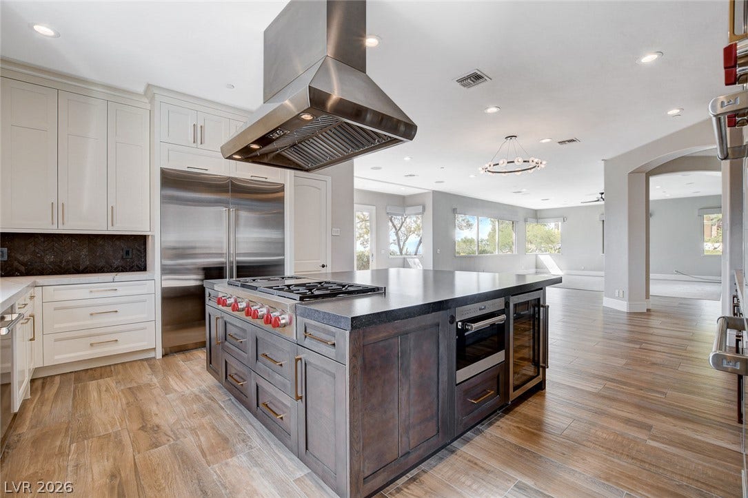 84 Kittansett Loop, Henderson, NV 89052 A spacious kitchen with a central island seamlessly transitions into the open living areas.