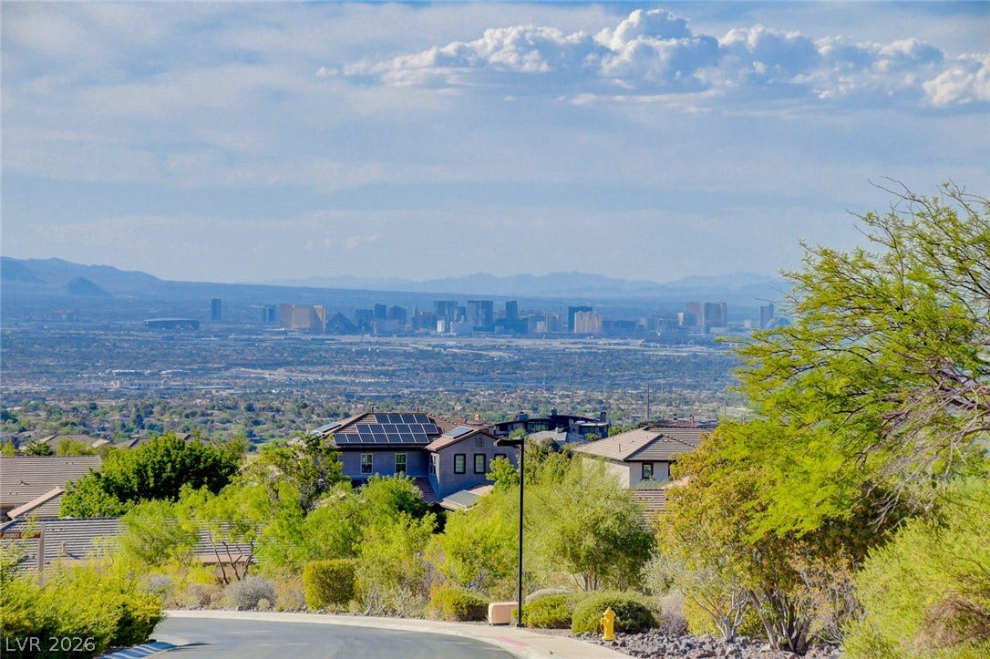84 Kittansett Loop, Henderson, NV 89052 Distant skyline vistas stretch across the horizon beyond the quiet neighborhood streets.