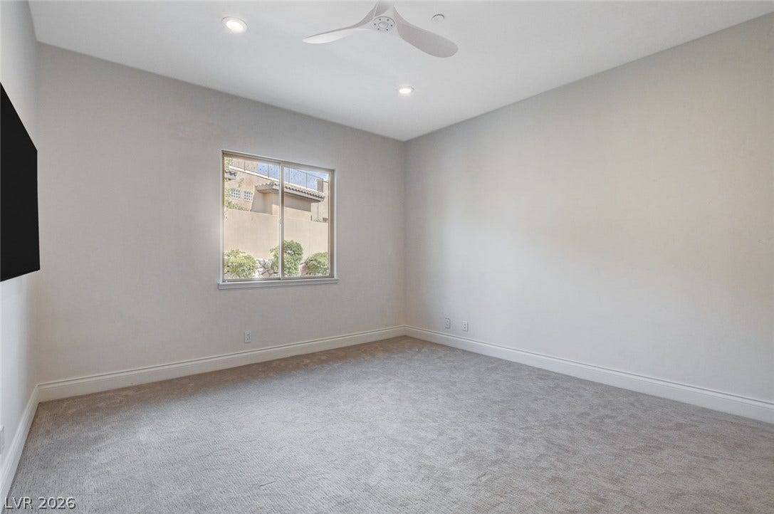 84 Kittansett Loop, Henderson, NV 89052 Recessed lighting and soft carpeting create a comfortable atmosphere in this versatile space.