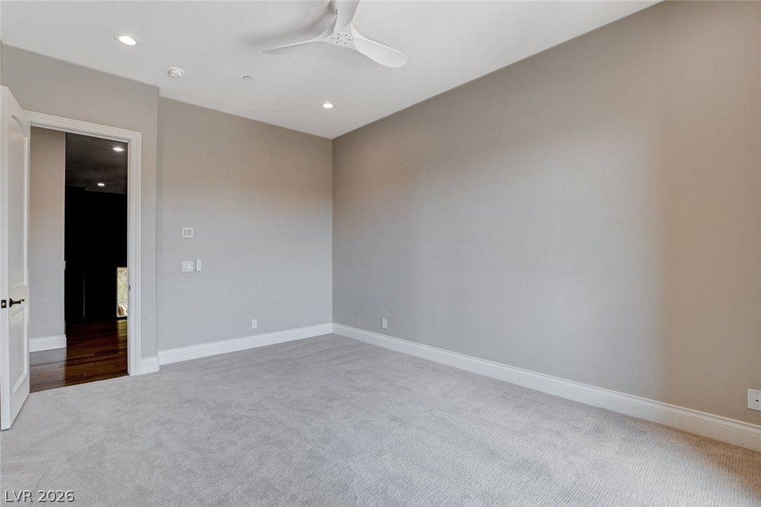 84 Kittansett Loop, Henderson, NV 89052 Plush carpeting and recessed lighting create a comfortable atmosphere in this versatile space.