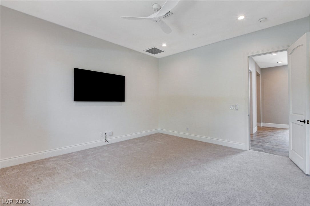 84 Kittansett Loop, Henderson, NV 89052 Soft carpeting underfoot defines this versatile bedroom space complete with modern recessed lighting.