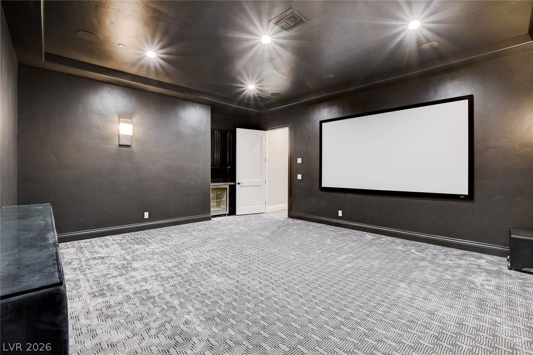 84 Kittansett Loop, Henderson, NV 89052 Textured dark walls and patterned carpeting create an immersive home theater experience.