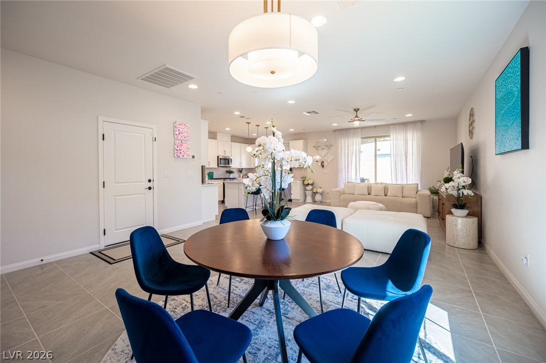 320 Della Pergola Place, Henderson, NV 89015 Gleaming tile floors and recessed lighting enhance this airy, modern open-concept living space.