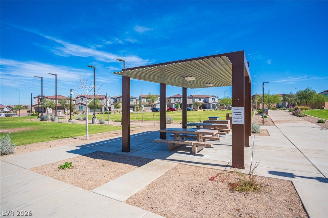 320 Della Pergola Place, Henderson, NV 89015 A shaded ramada structure overlooks a grassy park surrounded by paved walking paths.