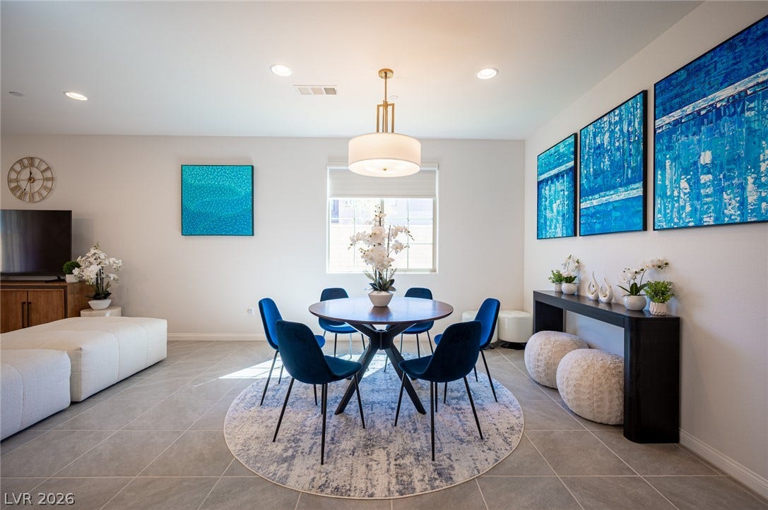 320 Della Pergola Place, Henderson, NV 89015 Clean tile flooring and abundant natural light define this versatile open dining space.
