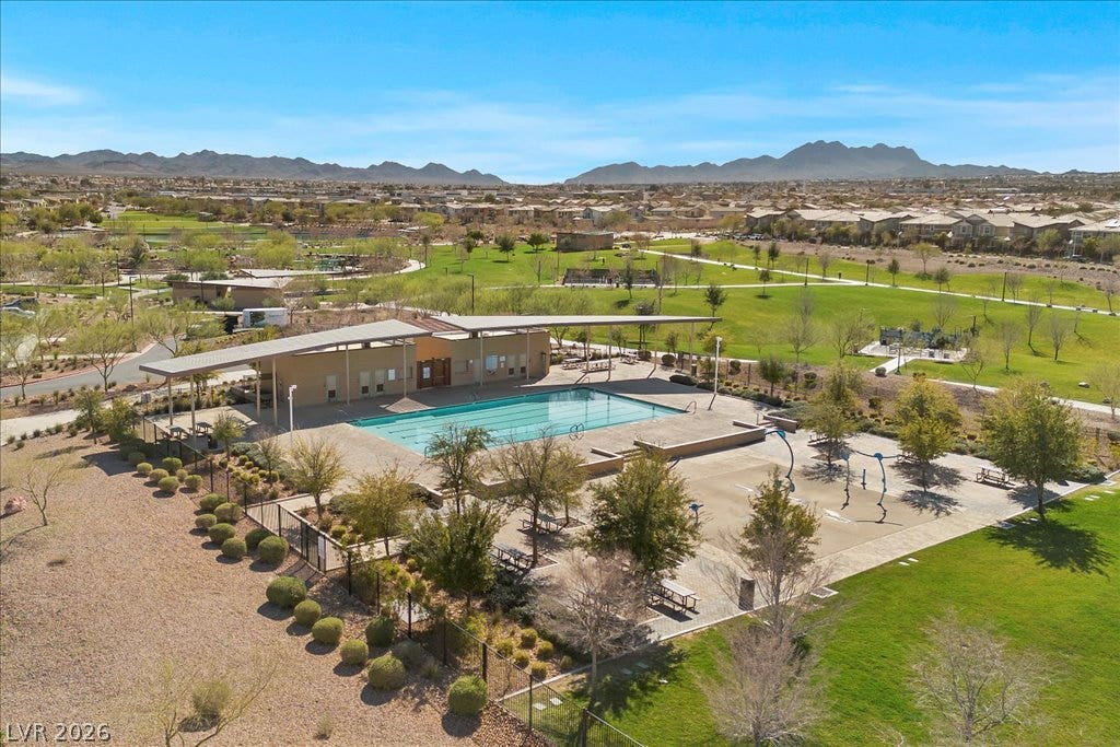 320 Della Pergola Place, Henderson, NV 89015 Majestic mountain vistas frame the community park and sparkling recreational swimming pool.