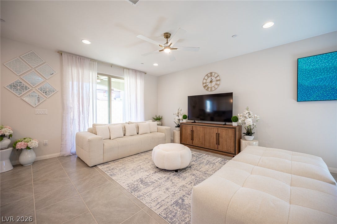 320 Della Pergola Place, Henderson, NV 89015 Recessed lighting and oversized tile flooring define this open living area.