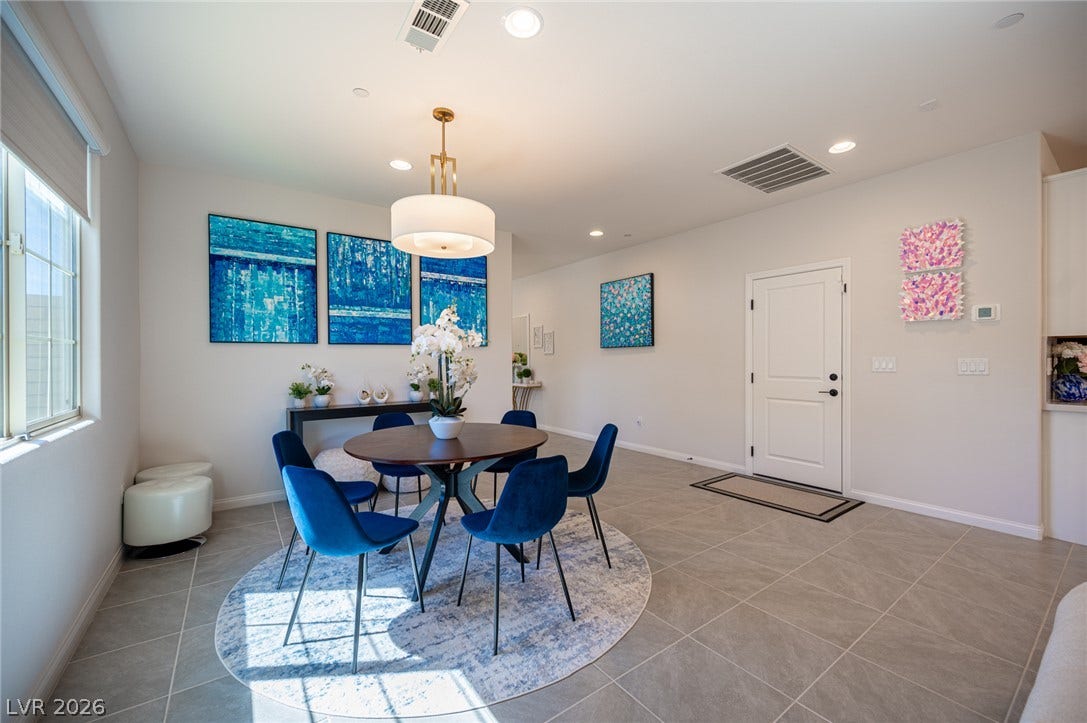 320 Della Pergola Place, Henderson, NV 89015 An inviting dining space with tiled flooring and recessed lighting sits adjacent to the entrance.